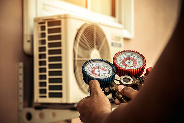 Professional Air Conditioning Service technician working in Bellvue, CO